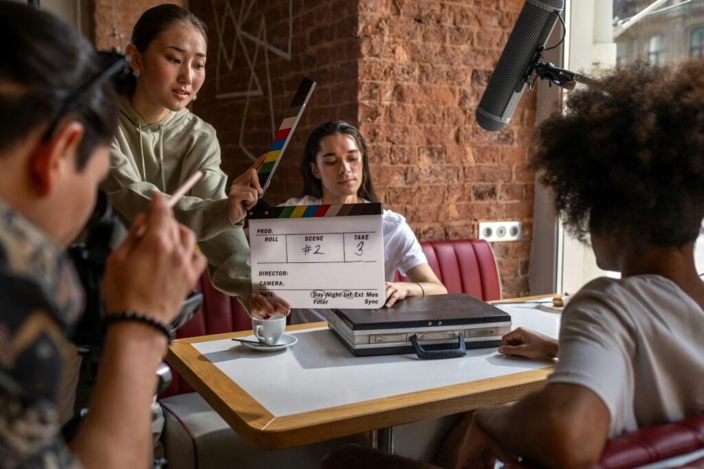 Engaging film crew capturing a scene indoors with diverse team and clapperboard.